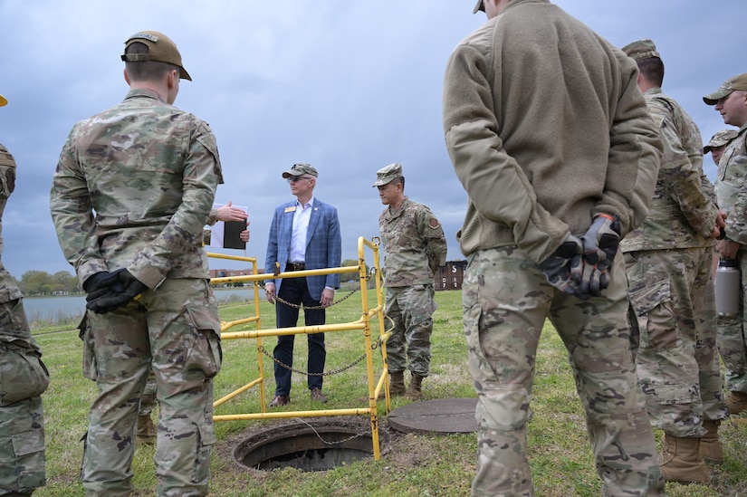 Michael Flanagan, Civilian Aide to the Secretary of the Army (CASA) for Virginia-South, talks with Airmen from the 633d Communications Squadron