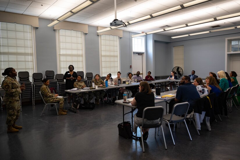 Master Sgt. Fagg speaks to a room.