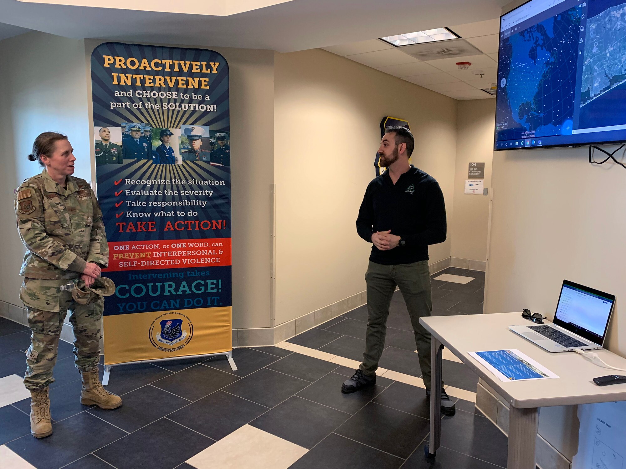 Mr. Joseph Graziano, Command Control, Computers and Communications, Intelligences Surveillance and reconnaissance contractor (C4ISR) for the 106th Operations Group, demonstrates to Brig. Gen. Denise Donnell, the commander of the New York Air National Guard, how the 106th Operations Group is testing out the SpaceX Starlink commercial internet satellite system along with the blue force tracking system as a way to track Airmen and aircraft on missions at Francis S. Gabreski ANGB, Westhampton Beach, N.Y., April 8, 2022. The goal, according to Mr. Joseph Graziano, is to use the commercial system, to track pararescuemen and aircraft when they are deployed for both domestic and overseas missions. The system allows internet access when there is no conventional network connectivity. (U.S. Air National Guard photo by Lt. Cheran A. Campbell)