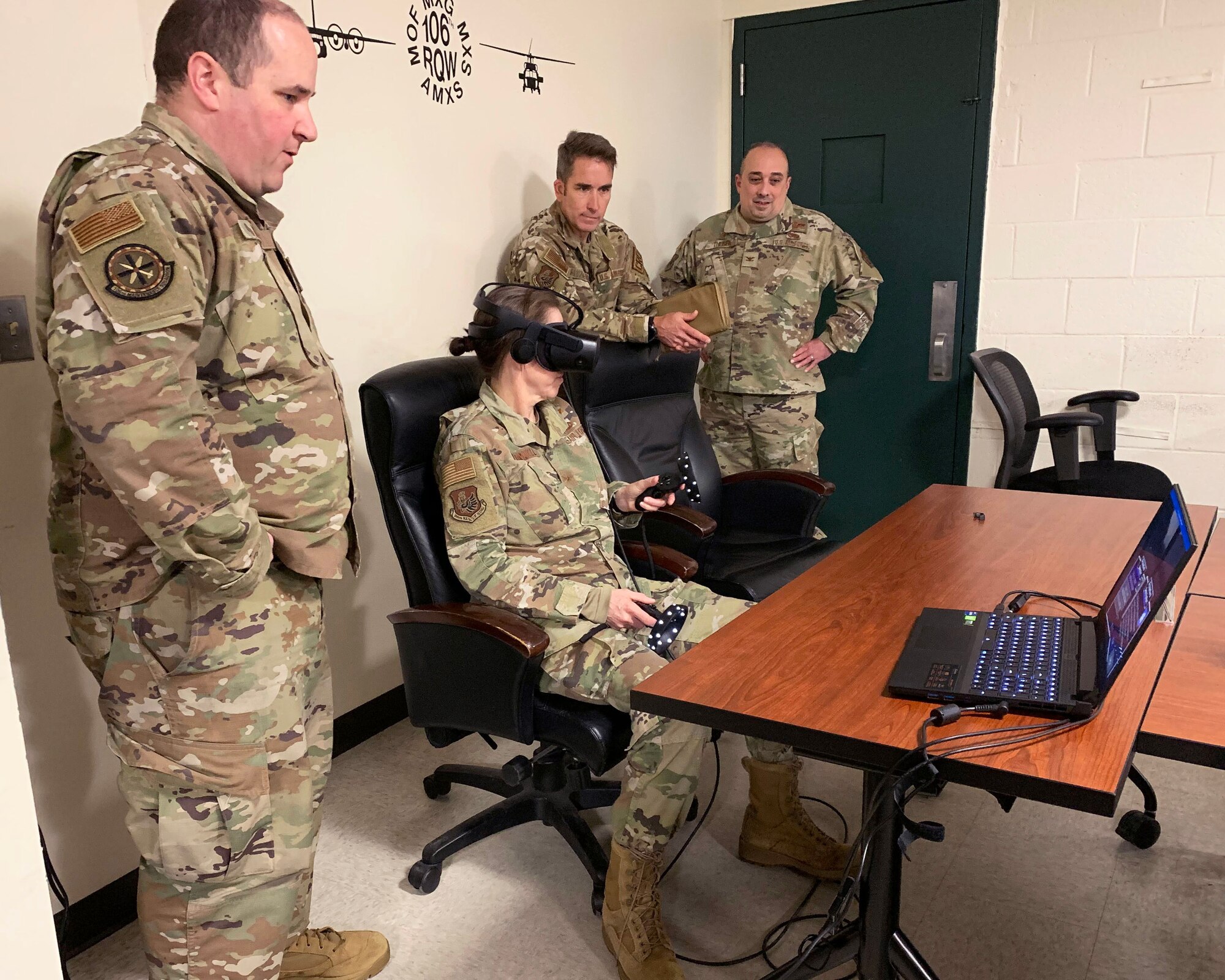 Master Sgt. Thomas Beall, 106th Rescue Wing aerospace propulsion superintendent, instructs Brig. Gen. Denise Donnell, the commander of the New York Air National Guard, on how to use the virtual reality Engine Run program at Francis S. Gabreski ANGB, Westhampton Beach, N.Y., April 8, 2022. The maintenance group is testing out a virtual reality Engine Run program, that teaches maintainers how to start and shutdown engines in accordance with their regulations through a virtual world. (U.S. Air National Guard photo by Lt. Cheran A. Campbell)