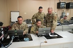 U.S. Airmen with the 156th Combat Communications Squadron, Puerto Rico Air National Guard, configure the network router, switch and phones to establish initial communications during Exercise Tropic Thunder at Camp Santiago Joint Training Center, Puerto Rico, April 11, 2022. Exercise Tropic Thunder is the first large-scale exercise for the 156th CBCS to build and maintain network functions from the ground up, to meet initial operational requirements while developing the cyber skills and teamwork required to operate in any combat communications environment.