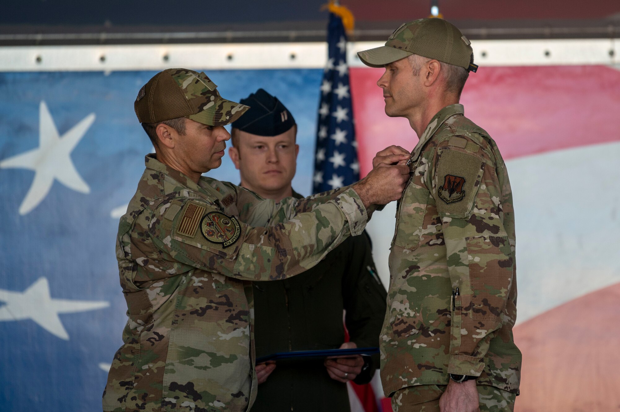Lt. Col. Jonathan Barber, outgoing 4th Operational Support Squadron commander, receives the Meritorious Service Medal during the 4th OSS change of command ceremony at Seymour Johnson Air Force Base, North Carolina, April 15, 2022. The Meritorious Service Medal is awarded to members of the armed services who distinguish themselves by outstanding service to the United States. (U.S. Air Force photo by Senior Airman Kevin Holloway)