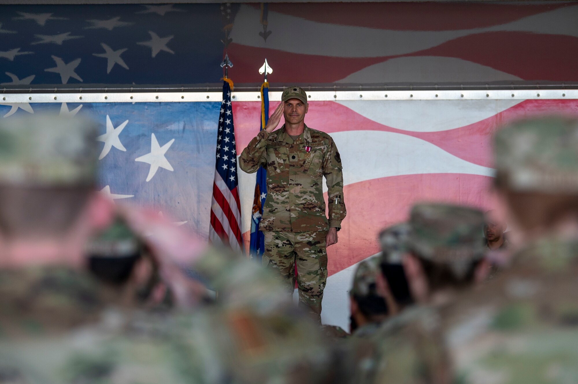 Lt. Col. Jonathan Barber, outgoing 4th Operations Support Squadron commander, renders his final salute to members of the 4th OSS at Seymour Johnson Air Force Base, North Carolina, April 15, 2022. Barber relinquished command of the 4th OSS to Lt. Col. Stephen Keefer. (U.S. Air Force photo by Senior Airman Kevin Holloway)