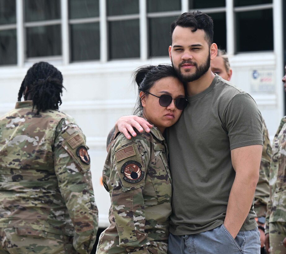 Airmen held by loved one