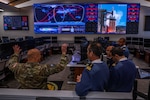 U.S. Space Force Col. Phillip Verroco, deputy director of the Combined Space Operations Center (CSpOC), explains the layout of the CSpOC operations floor to members of a delegation of French officers Apr. 15, 2022, at Vandenberg Space Force Base, Calif. The delegation spent a week with USSPACECOM, CFSCC, the Combined Space Operations Center, and the 18th Space Defense Squadron to become more familiar with Operation OLYMPIC DEFENDER mission areas, and to discuss potential future operational support and partnership opportunities in the space domain. The French Space Command stood up in September 2019 and is in charge of operations support, space service support and space defense. (U.S. Space Force photo by Tech. Sgt Luke Kitterman)