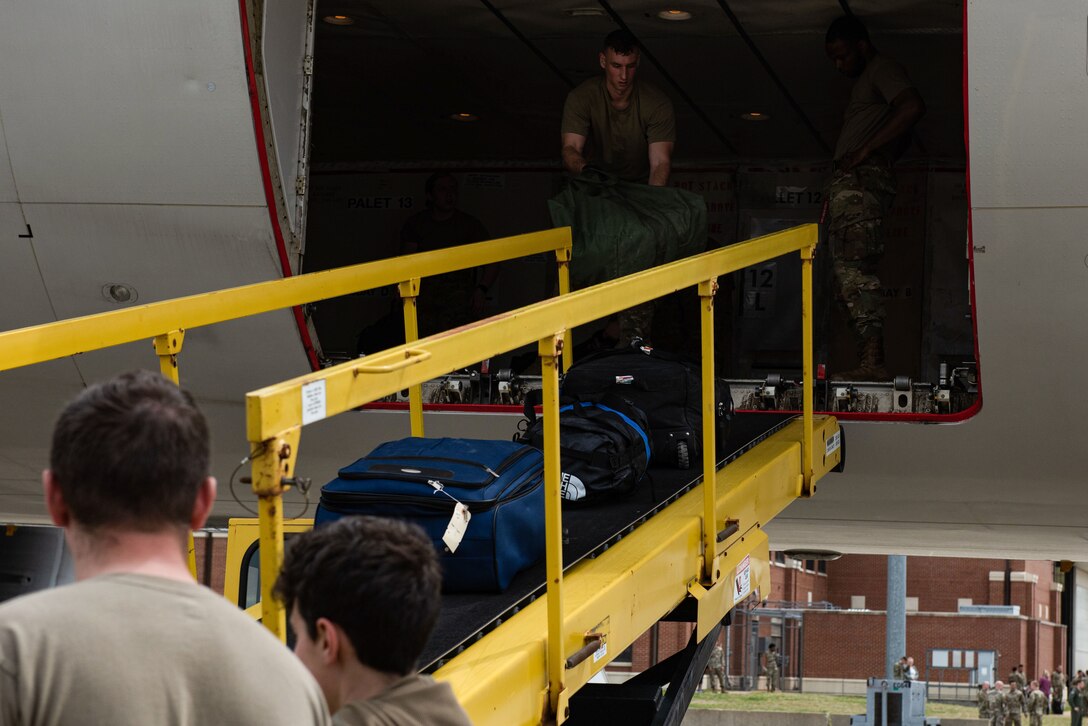 Airmen unload plane