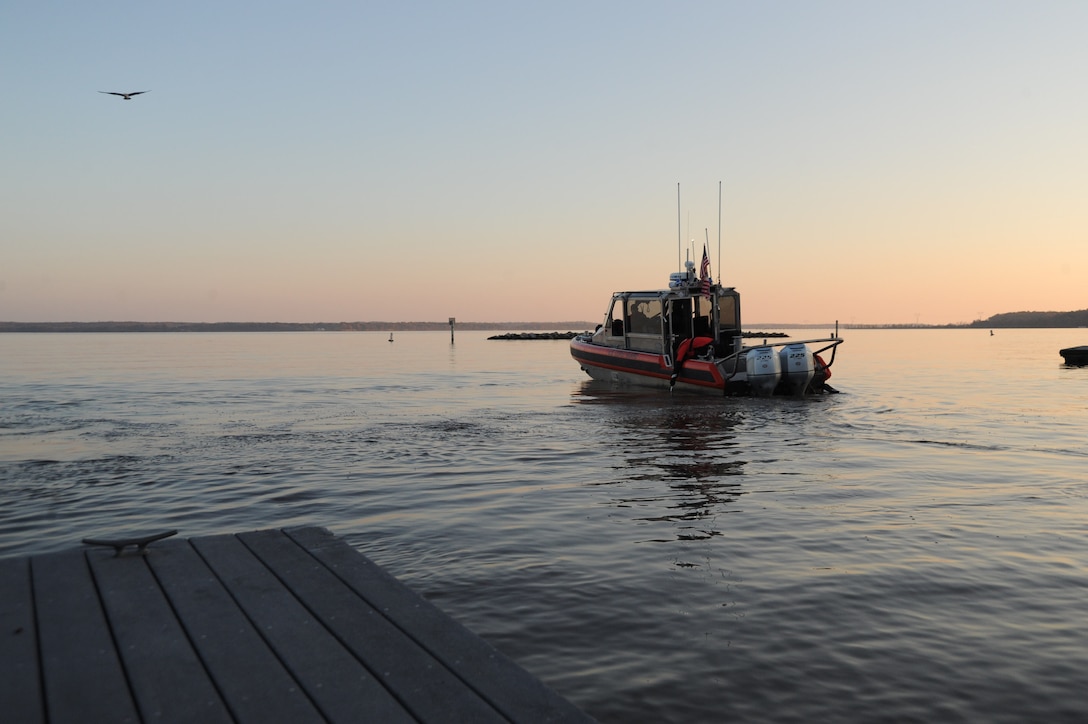 Response boat on a river at sunset