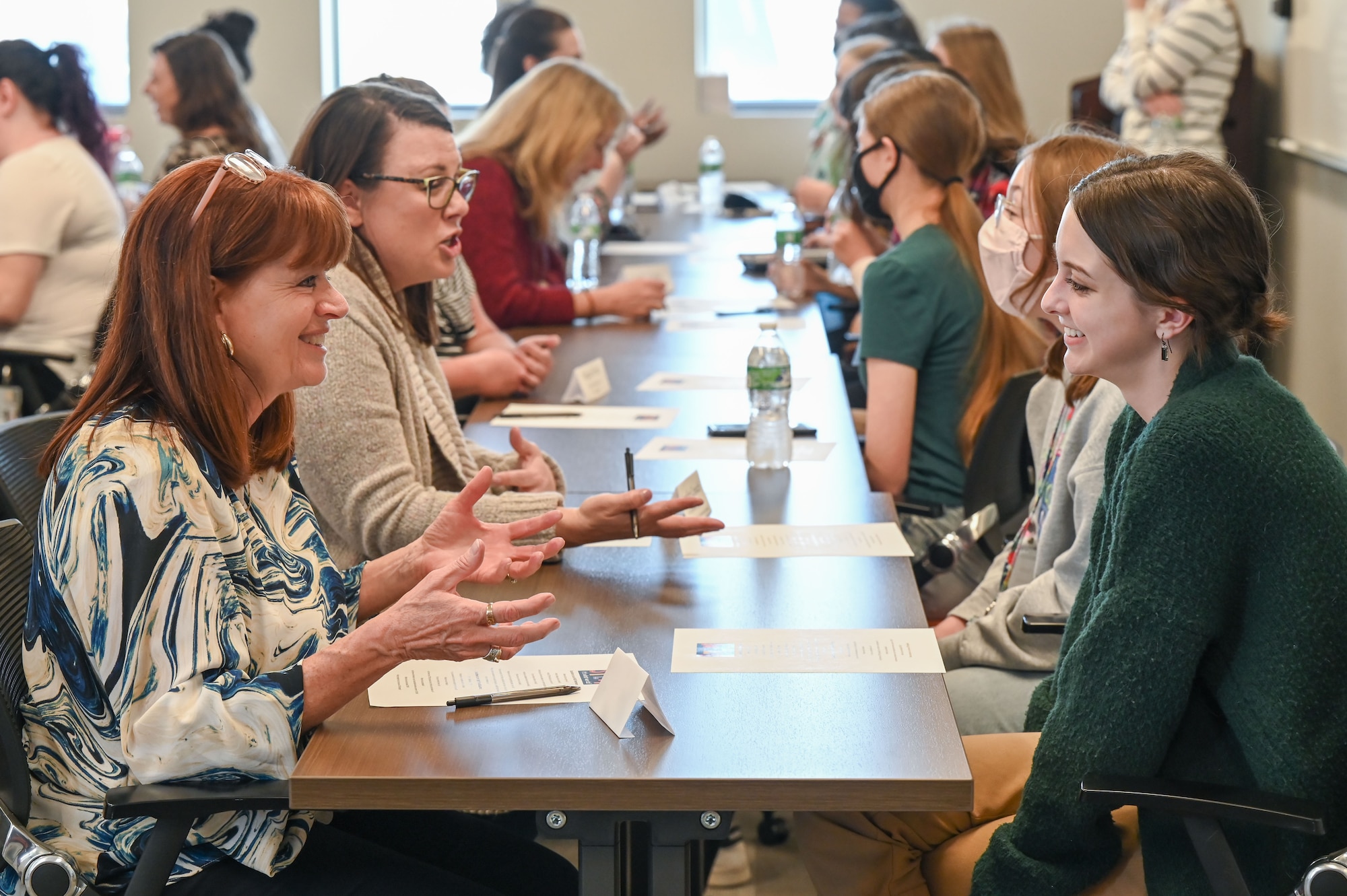 Women engineers and scientists from Hill Air Force Base, Utah, meet with female high school students during a Science, Technology, Engineering and Math (STEM) event March 30, 2022.