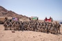 U.S. Marines assigned to Fox Company, 2nd Battalion, 24th Marines, Jordanian Marines from the 77th Royal Jordanian Marine Battalion, and members of the 61st Quick Reaction Force Battalion, King Abdullah II Special Forces Group pose for a photo during exercise Intrepid Maven (IM) 22-1 aboard Camp Titin, Jordan, March 18. IM is a bilateral engagement series between U.S. Marine Corps Forces, Central Command and the Jordanian Armed Forces (JAF) that provides an opportunity to exchange military tactics and expertise. IM 22-1 is the first of multiple engagements scheduled between the U.S. Marine Corps and the JAF to increase interoperability, strengthen our enduring partnership, deter malign actors in the region, and ensure optimal readiness to respond to a variety crisis and contingency operations in the U.S. Central Command area of responsibility. (U.S. Marine Corps photo by Cpl. James Stanfield)