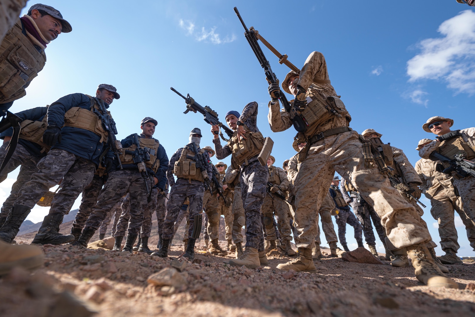 U.S. Marines with 2nd Battalion, 24th Marines and Jordanian Marines from the 77th Royal Jordanian Marine Battalion compete in an ammunition speed reload challenge during exercise Intrepid Maven (IM) 22-1, aboard Camp Titin, Jordan, March 15. IM is a bilateral engagement series between U.S. Marine Corps Forces, Central Command and the Jordanian Armed Forces (JAF) that provides an opportunity to exchange military tactics and expertise. IM 22-1 is the first of multiple engagements scheduled between the U.S. Marine Corps and the JAF to increase interoperability, strengthen our enduring partnership, deter malign actors in the region, and ensure optimal readiness to respond to a variety crisis and contingency operations in the U.S. Central Command area of responsibility. (U.S. Marine Corps photo by Cpl. James Stanfield)