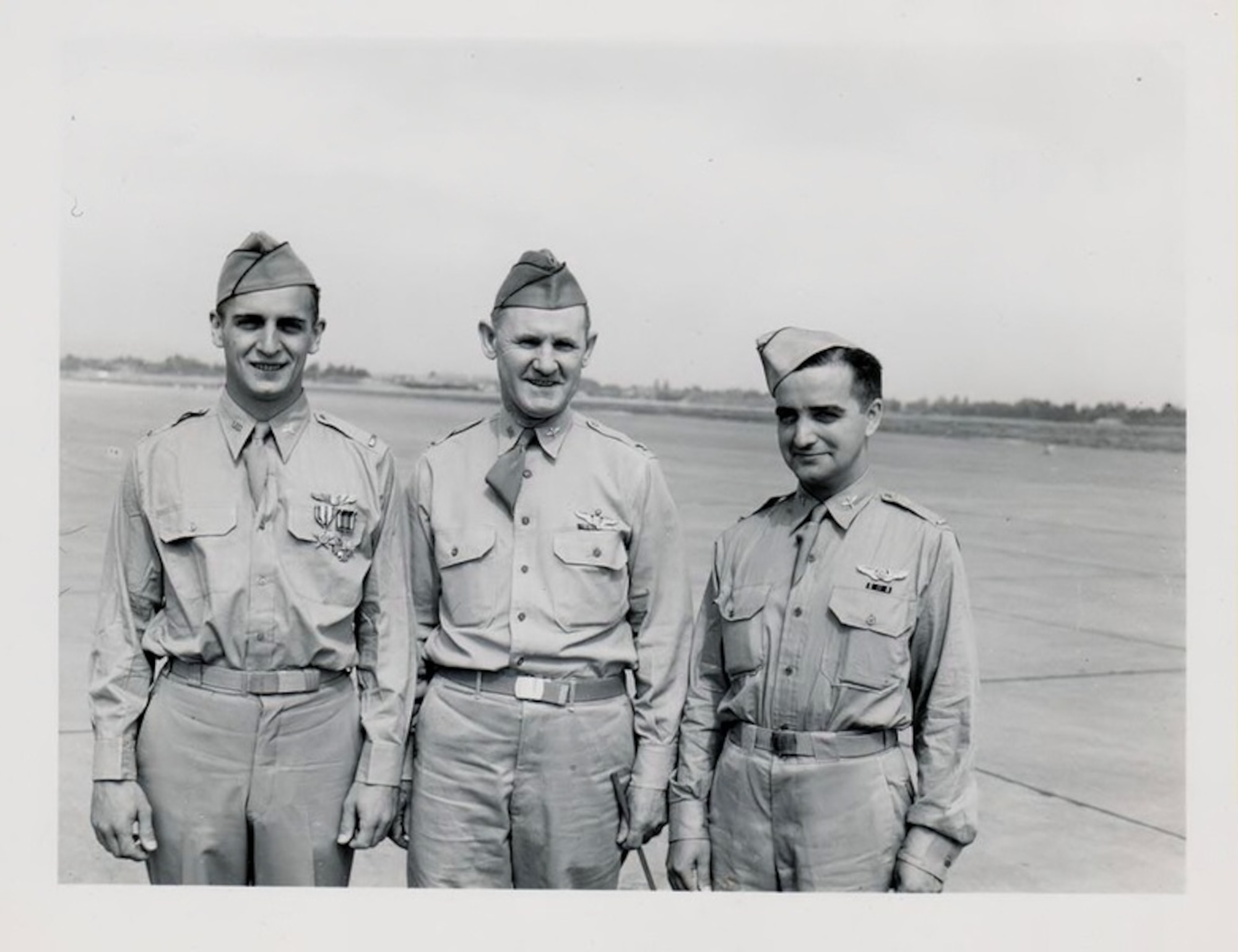 Two Oregon-members of Crew 7 returned home in the summer of 1942 on leave.  Pictured here at Portland Army Air Base, Oregon, left to right are Lt. Dean Davenport, Col. Joseph L. Stromme, PAAB Commander and Lt. Robert S. Clever.  This photo was possibly taken on July 16, 1942, during the PAAB change of command and review of troops ceremony.  (Children of the Doolittle Raiders.com)