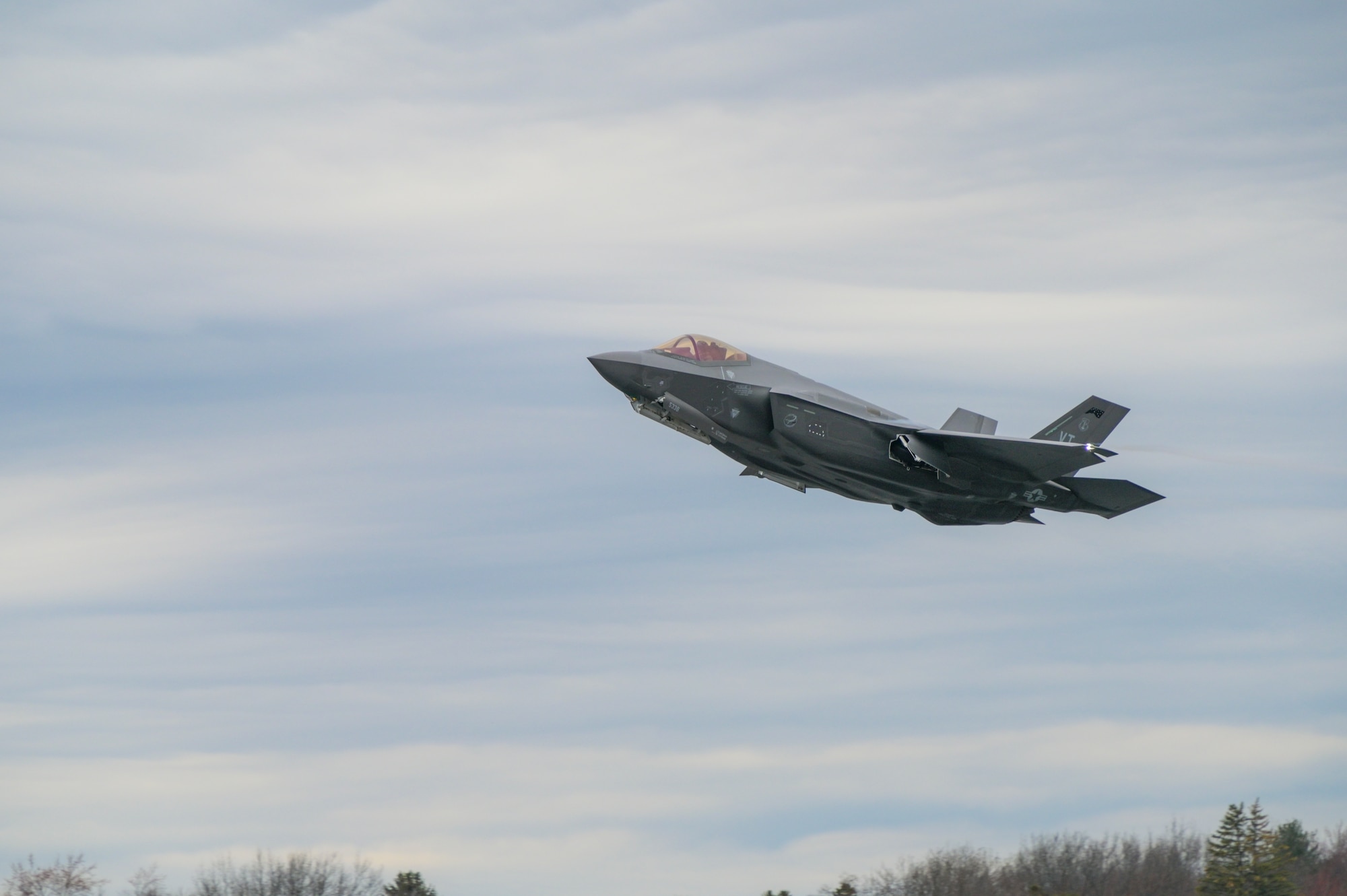 An F-35 Lightning II Aircraft assigned to the 158th Fighter Wing, Burlington Air National Guard Base, Vermont takes off April 13, 2022 from Burlington International Airport, Vermont. The Vermont Air National Guard was the first unit of the Air National Guard to receive the 5th Generation fighter and Madison's 115th Fighter Wing is scheduled to be the second with the arrival of its first F-35 in spring of 2023. (U.S. Air National Guard photo by Staff Sgt. Cameron Lewis)