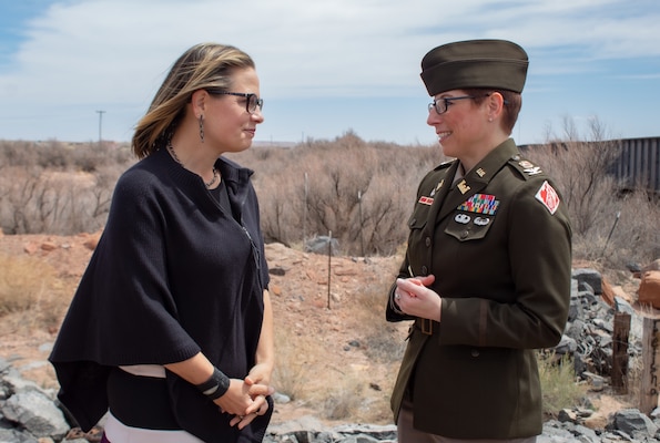 Arizona Sen. Krysten Sinema, left, and Col. Julie Balten, U.S. Army Corps of Engineers Los Angeles District commander, right, discuss project details regarding the Little Colorado River at Winslow Flood-Control project after a site visit and panel presentation April 11 in Winslow, Ariz. The project is receiving more than $65 million in federal funding from the bipartisan Infrastructure and Investment Jobs Act to complete design and construction of the levee system. The project also will help remove the invasive plant species, salt cedar, pictured behind them. (Photo by Robert DeDeaux, Los Angeles District PAO)