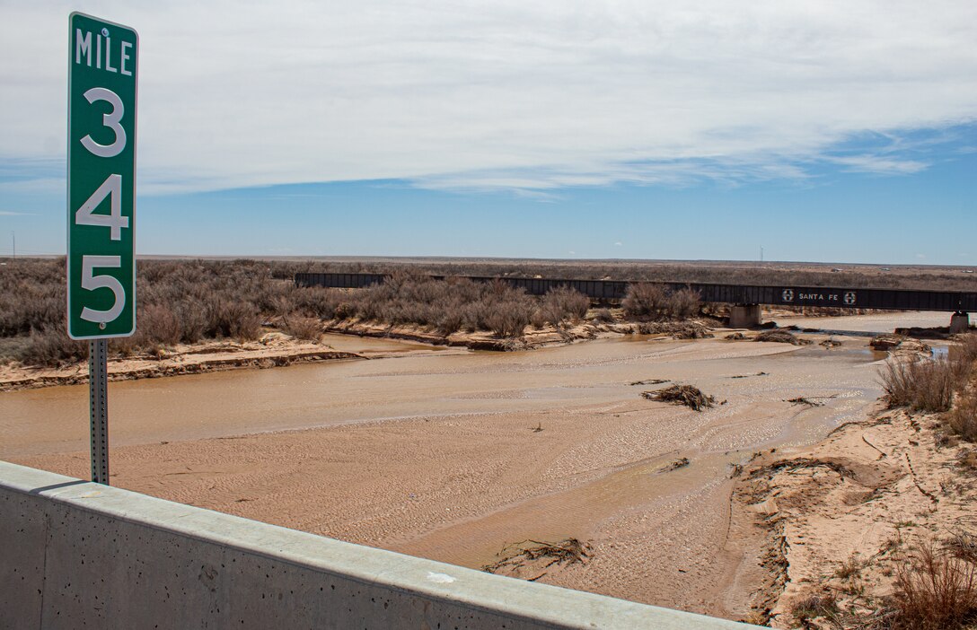 The Little Colorado River flows underneath bridges at mile marker 345 April 11 in Winslow, Ariz. Salt cedar, an invasive plant species along the banks and riverbed, increases the chance and severity of fires and floods in Navajo County. (Photo by Robert DeDeaux, Los Angeles District PAO)