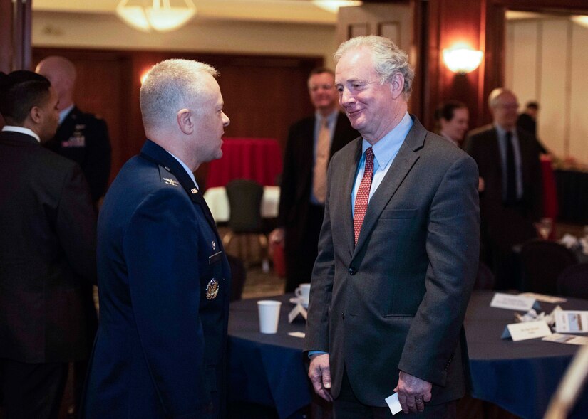 Col. Tyler Schaff, 316th Wing and installation commander, left, meets with U.S. Sen. Chris Van Hollen, from Maryland, during the Joint Base Andrews State of the Base at the Club at Andrews at Joint Base Andrews, Md, April 12, 2022.