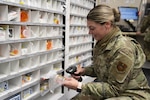 Air Force Pharmacist Technician Scans Prescription Drug Container