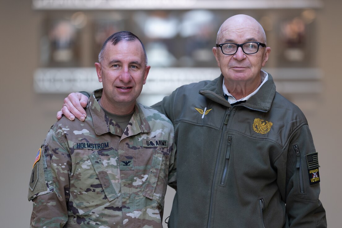 U.S. Army Central, Col. Joel Holmstrom stands next to his father, retired Army Maj. Robert Holmstrom.