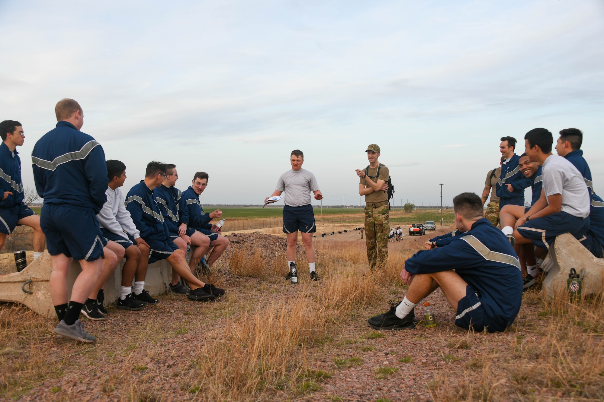 U.S. Air Force Capt. James Newman, 97th Training Squadron flight commander, leads a group of students in an Airmanship lesson at Altus Air Force Base, Oklahoma, April 10, 2022. The Airmanship lessons were focused on the Air Force core values: integrity first, service before self and excellence in all we do. (U.S. Air Force photo by Airman 1st Class Trenton Jancze)