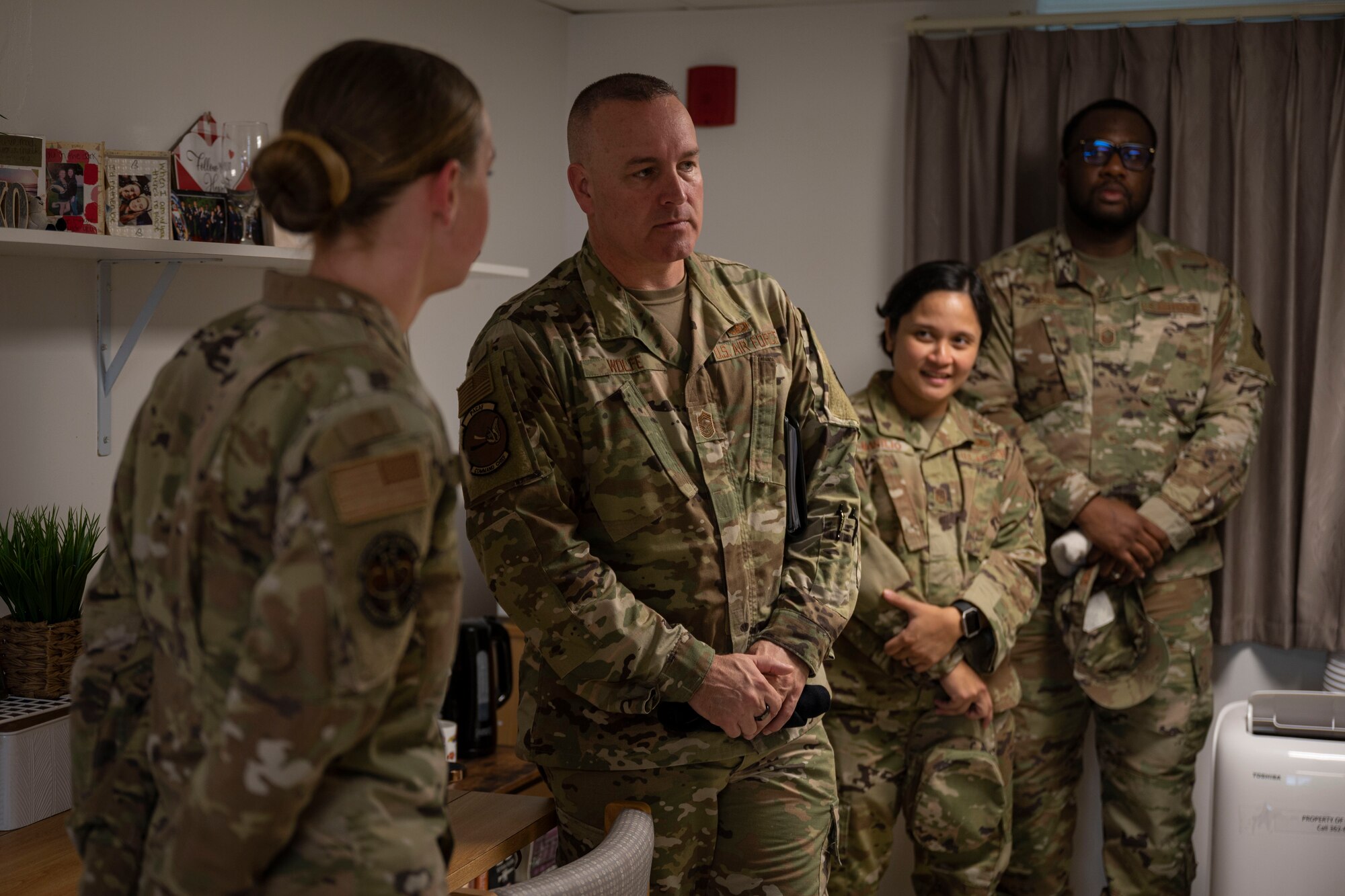 U.S. Air Force Chief Master Sgt. David R. Wolfe, Pacific Air Forces command chief, visits the 36th Wing Dorm of the Quarter winner during a tour of Andersen Air Force Base, Guam, April 14, 2022.