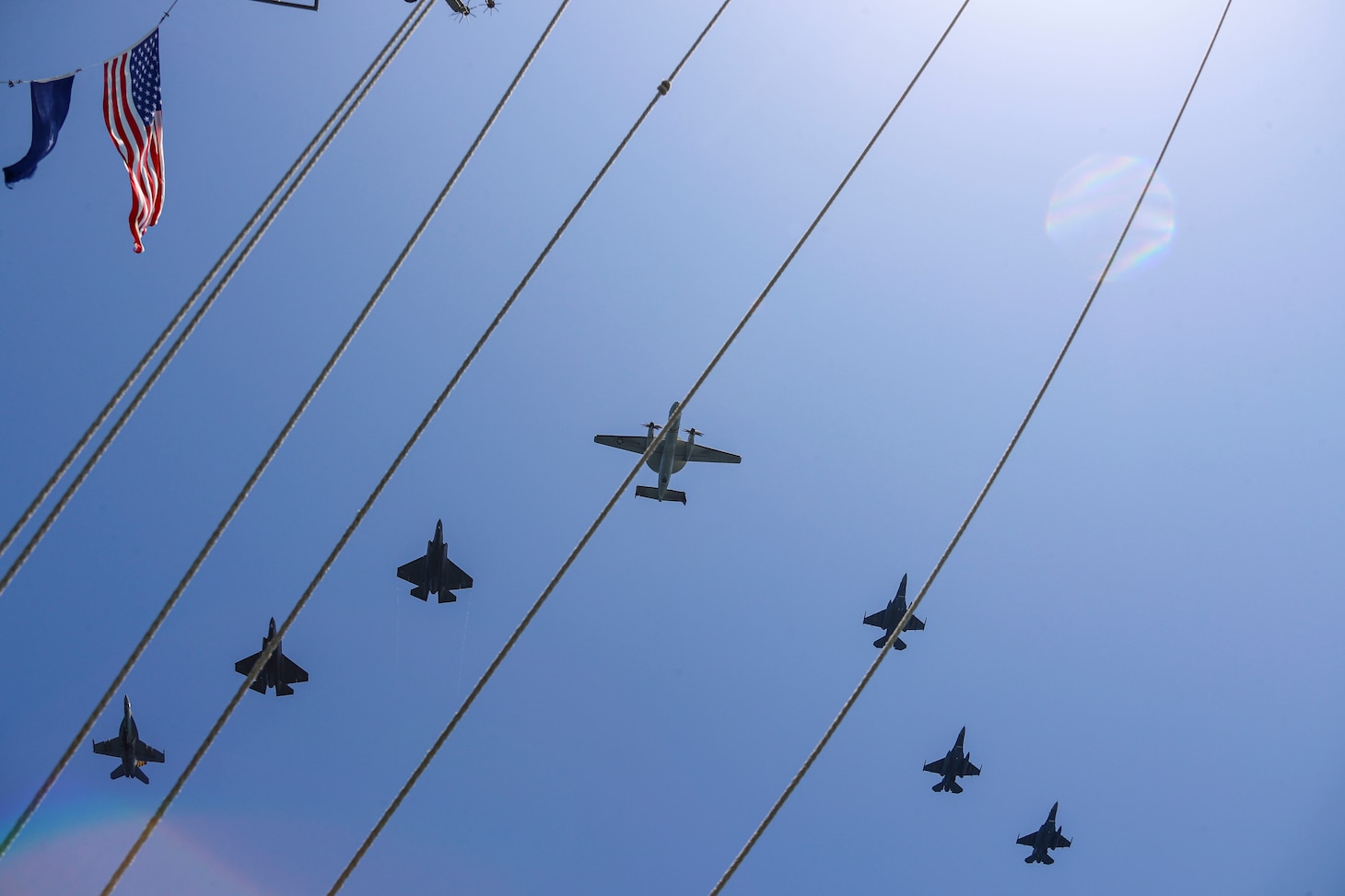 SEA OF JAPAN (April 12, 2022) Aircraft from Carrier Air Wing (CVW) 9 and Japan Air Self-Defense Force fly in formation over the Nimitz-class aircraft carrier USS Abraham Lincoln (CVN 72) during a U.S.-Japan bilateral exercise. During bilateral exercises between Abraham Lincoln Carrier Strike Group and Japan Maritime Self-Defense Force, the two navies strengthen all-domain awareness and maneuvers across a distributed maritime environment. Bilateral operations like this one, reassure our allies and partners of the U.S. commitment to maintaining a free and open Indo-Pacific region. (U.S. Navy photo by Mass Communication Specialist 3rd Class Javier Reyes)