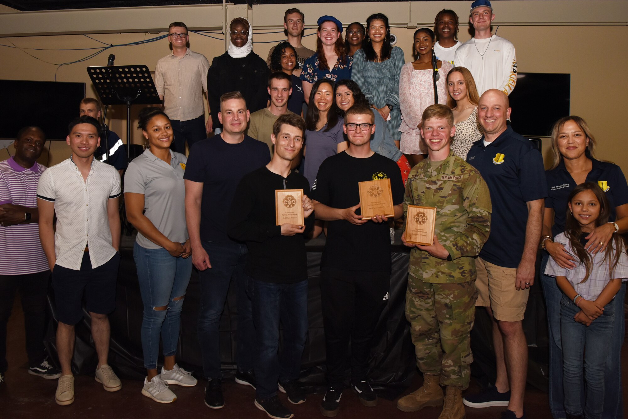 Judges, award winners, and attendees from the Goodfellow student talent show pose for a photo at the Crossroads, Goodfellow Air Force Base, Texas, April 15, 2022. 17th Training Wing leadership participated in the event and imparted the importance of building strong bonds with service members outside of the training environment. (U.S. Air Force photo by Senior Airman Michael Bowman)