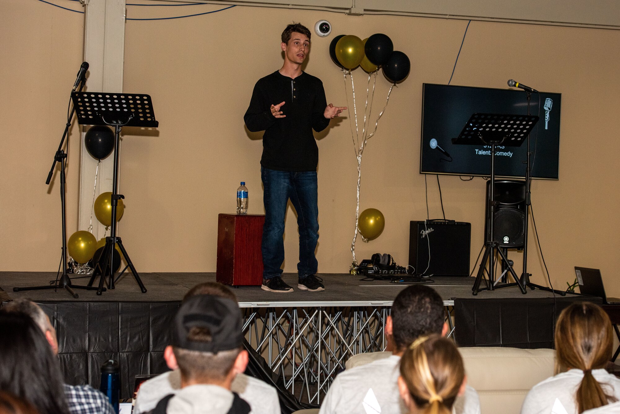 U.S. Air Force Airman Davyd Miller, 316 Training Squadron student, performs a stand-up comedy routine at the Crossroads, Goodfellow Air Force Base, Texas, April 15, 2022. Miller placed third during the competition. (U.S. Air Force photo by Senior Airman Michael Bowman)