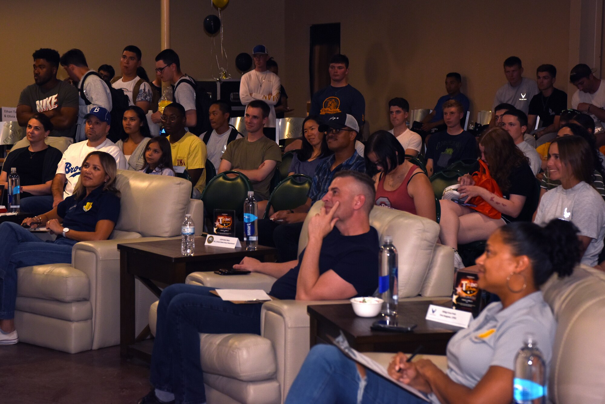 Goodfellow audience members watch a performance during the student talent show at the Crossroads, Goodfellow Air Force Base, Texas, April 15, 2022. The show featured a variety of performances, from stand-up comedy, live musical performances, and yo-yo tricks. (U.S. Air Force photo by Senior Airman Michael Bowman)
