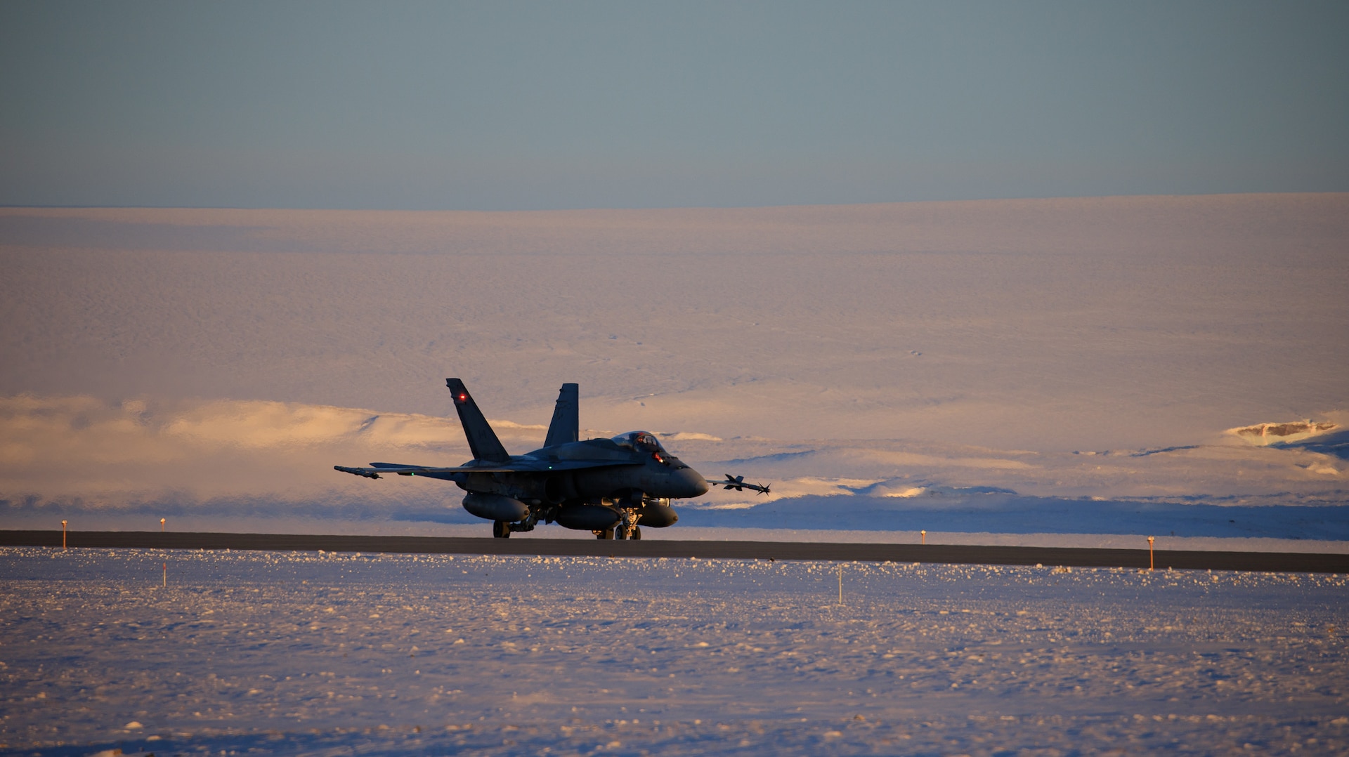 A Royal Canadian Air Force CF-18 Hornet makes its approach for takeoff during Operation NOBLE DEFENDER at Thule Air Base, Greenland, March 13, 2022.