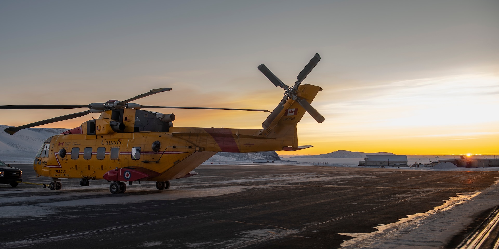 A Royal Canadian Air Force CH-149 Cormorant Search and Rescue helicopters positions itself on the airfield in preparation for Operation NOBLE DEFENDER at Thule Air Base, Greenland, March 14, 2022.