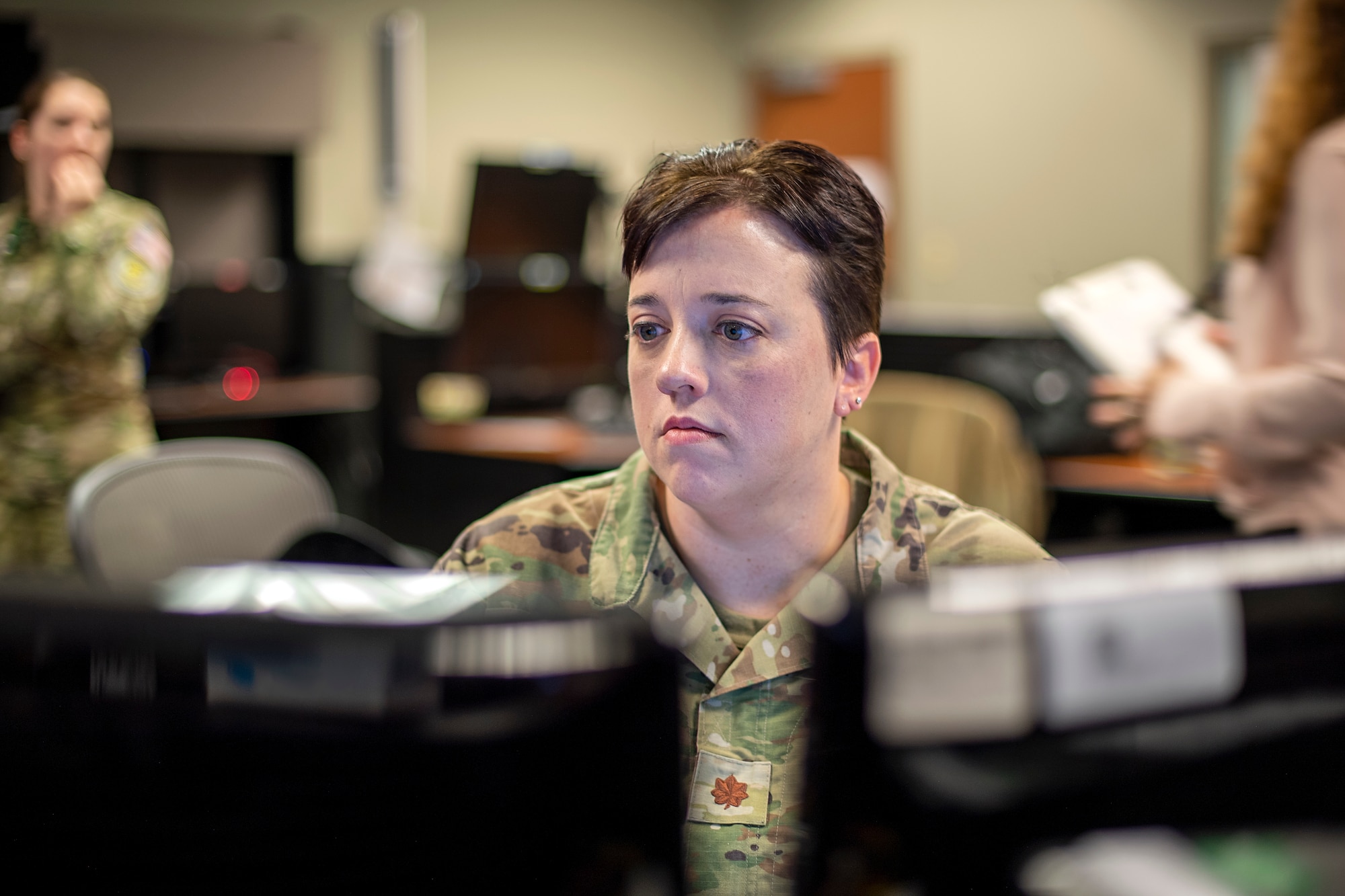 U.S. Space Force Maj Sallie Duncan, Joint Overhead Persistent Infrared Center Subject Matter Expert provides support to the Missile Warning Delta 4 crews during the SPACE FLAG 22-2 exercise.  She provided assistance with taskings of the Overhead Persistent Infrared Sensors to provide realistic Missile Warning training during SPACE FLAG 22-2 execution. (U.S. Space Force photo by Ms. Judi Tomich)