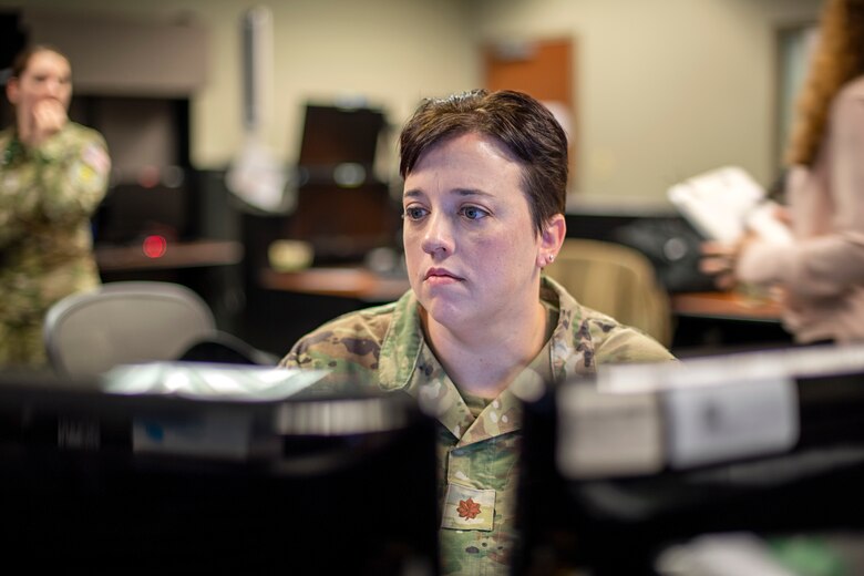 U.S. Space Force Maj Sallie Duncan, Joint Overhead Persistent Infrared Center Subject Matter Expert provides support to the Missile Warning Delta 4 crews during the SPACE FLAG 22-2 exercise.  She provided assistance with taskings of the Overhead Persistent Infrared Sensors to provide realistic Missile Warning training during SPACE FLAG 22-2 execution. (U.S. Space Force photo by Ms. Judi Tomich)