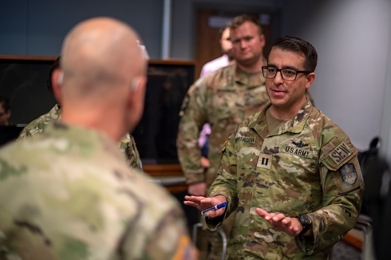 •	U.S. Army CPT Justin Martirosian (right) 1st Space Brigade briefs MG Tom James (left) Joint Task Force – Space Defense Commander on their Space Electronic Warfare package plan during SPACE FLAG 22-2 execution. (U.S. Space Force photo by Ms. Judi Tomich)