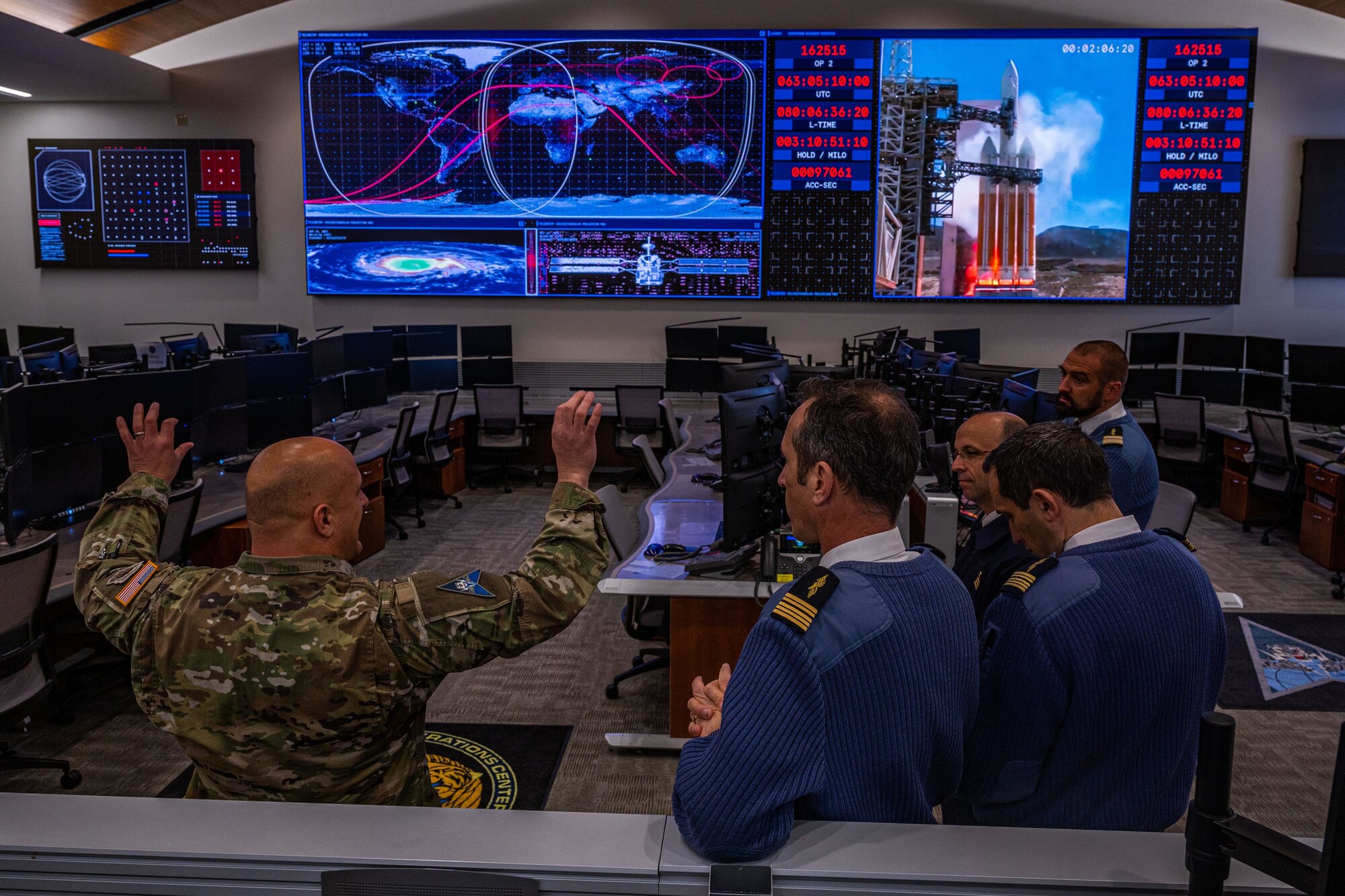 U.S. Space Force Col. Phillip Verroco, deputy director of the Combined Space Operations Center (CSpOC), explains the layout of the CSpOC operations floor to members of a delegation of French officers Apr. 15, 2022, at Vandenberg Space Force Base, Calif. The delegation spent a week with USSPACECOM, CFSCC, the Combined Space Operations Center, and the 18th Space Defense Squadron to become more familiar with Operation OLYMPIC DEFENDER mission areas, and to discuss potential future operational support and partnership opportunities in the space domain. The French Space Command stood up in September 2019 and is in charge of operations support, space service support and space defense. (U.S. Space Force photo by Tech. Sgt Luke Kitterman)