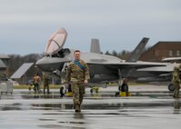 U.S. Air Force Staff Sgt. Marcel Emond, a crew chief assigned to the Wisconsin Air National Guard's 115th Fighter Wing, walks in front of a Vermont Air National Guard F-35 Lightning II aircraft April 13, 2022 at Burling Air National Guard Base, Vermont. Emond has been training as a crew chief at the 158th Fighter Wing in Burlington for just over a year as part of the 115th Fighter Wing's transition to the F-35. (U.S. Air National Guard photo by Staff Sgt. Cameron Lewis)