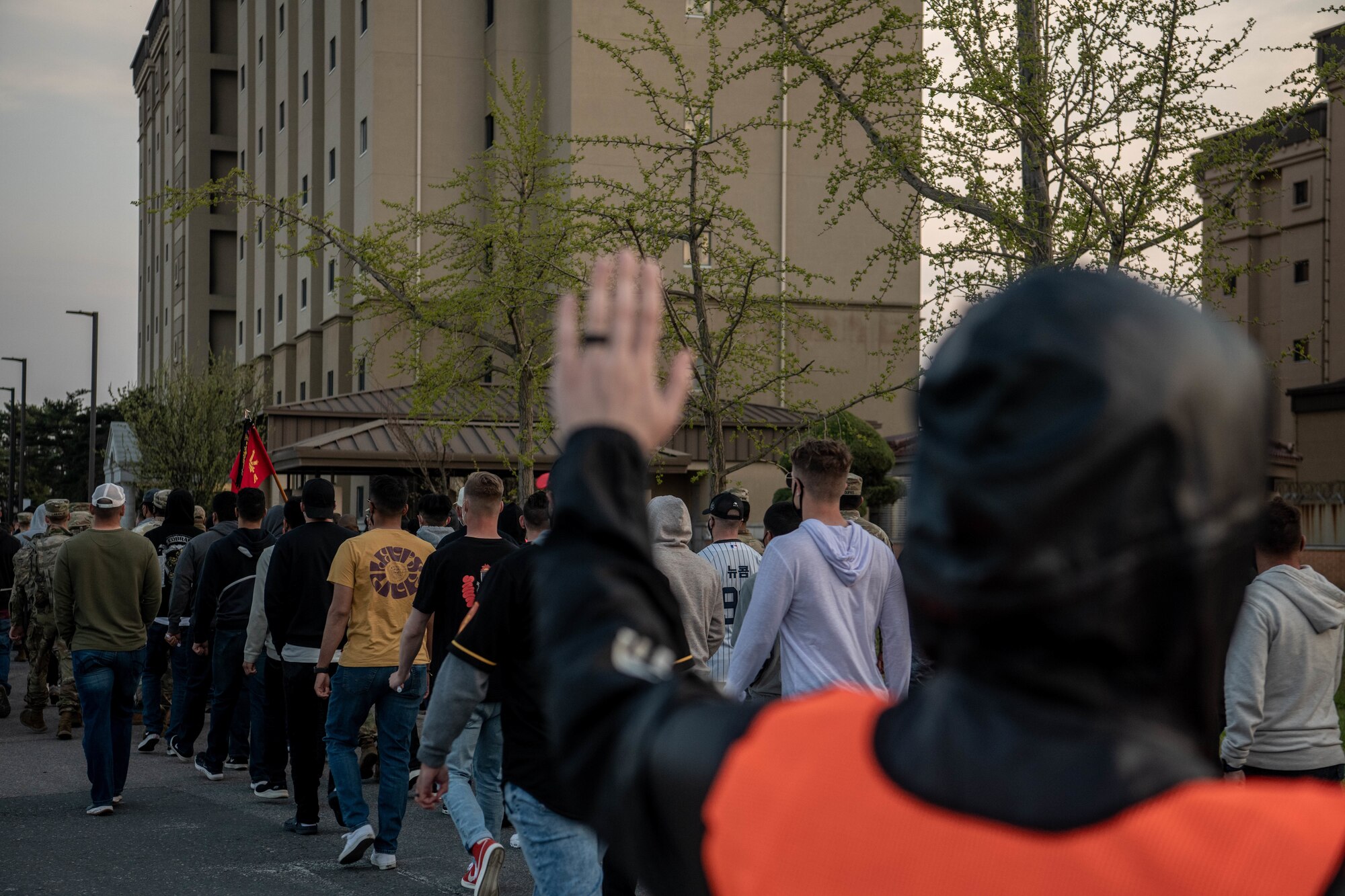 Service members walk during a sexual assault prevention event.