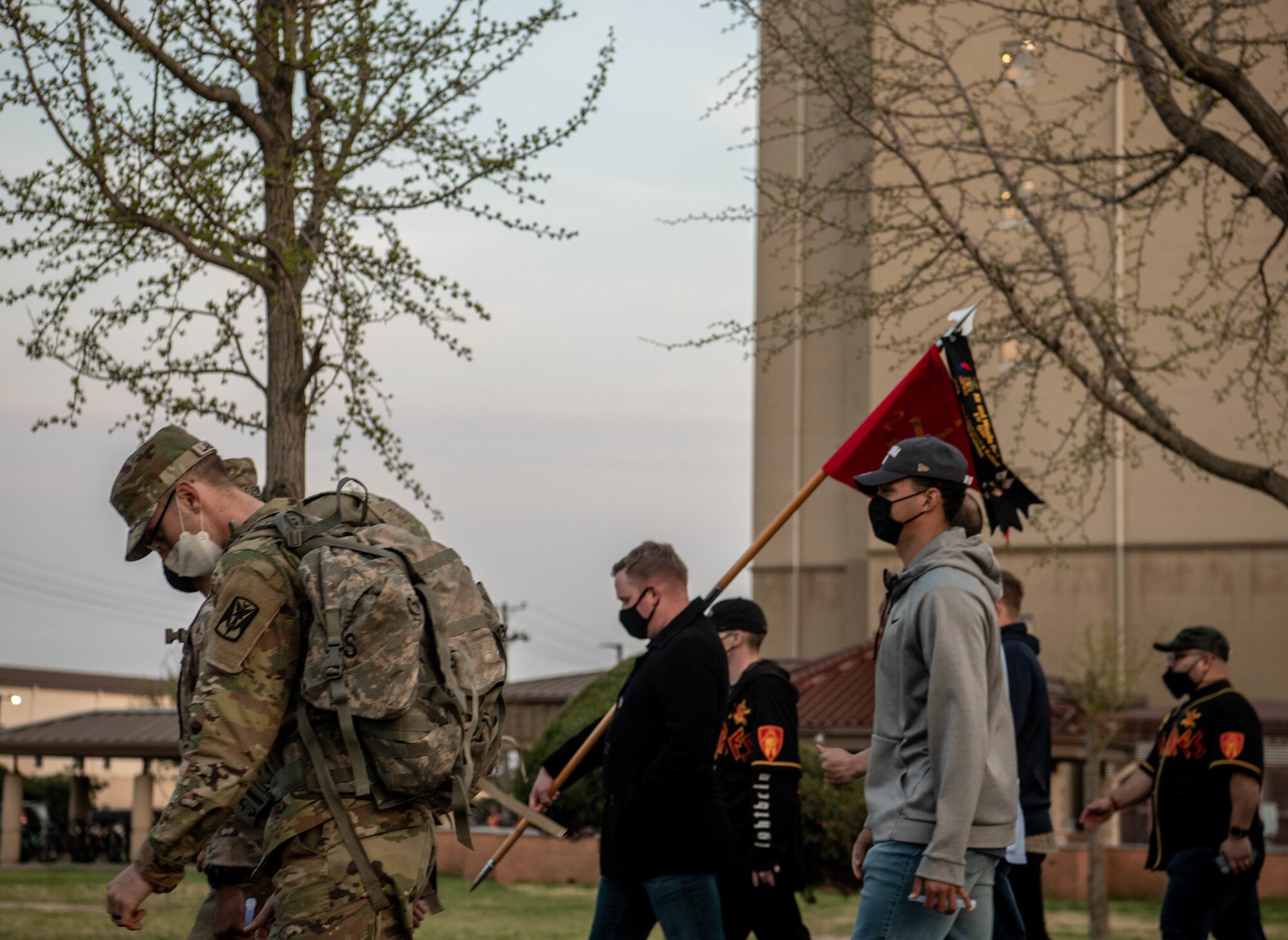Service members walk during a sexual assault prevention event.