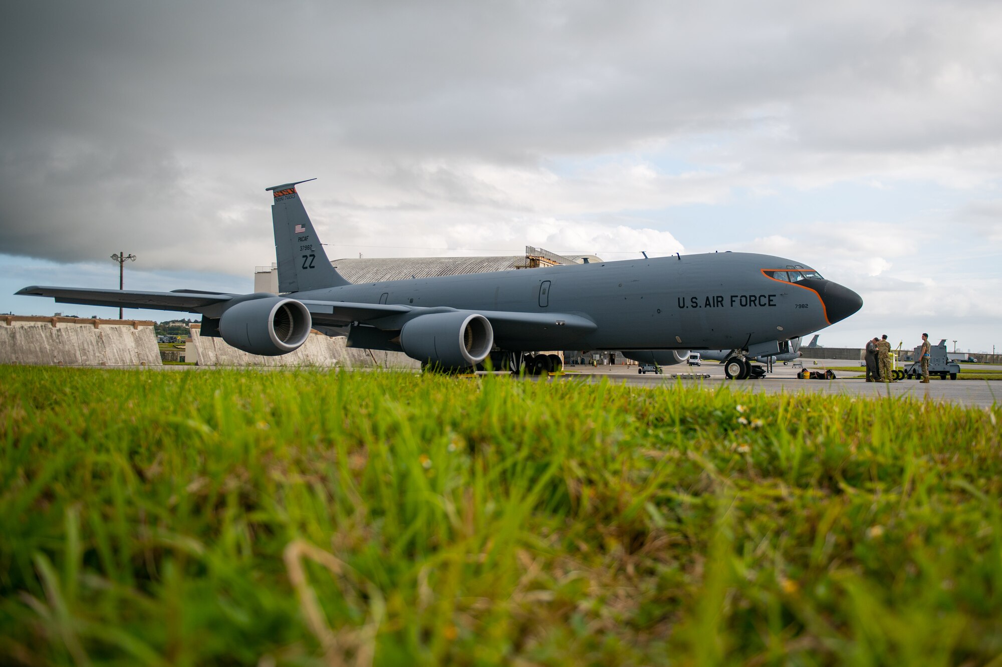 A plane sits waiting for takeoff at a flightline