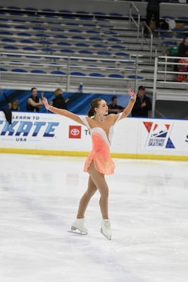 Marin Blaisdell, a materials engineer for the U.S. Army Engineer Research and Development Center's Cold Regions Research and Engineering Laboratory, skates across the ice during her performance at the 2022 U.S. Adult Figure Skating National Championships held in Newark, Delaware, April 6-9, 2022.