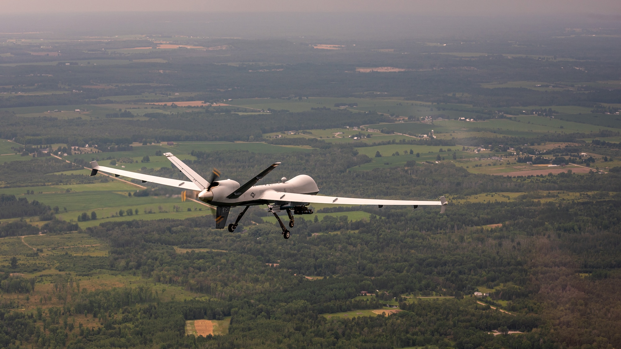 An MQ-9 Reaper assigned to the 214th Attack Group, Arizona Air National Guard, flies over Alpena, Mich., during a training sortie during Northern Strike 19 at the Alpena Combat Readiness Training Center, July 24, 2019. 2019 marked the remotely piloted aircraft’s historical debut at the joint force, multinational combat exercise. (U.S. Air National Guard photo by Tech. Sgt. Lealan Buehrer)