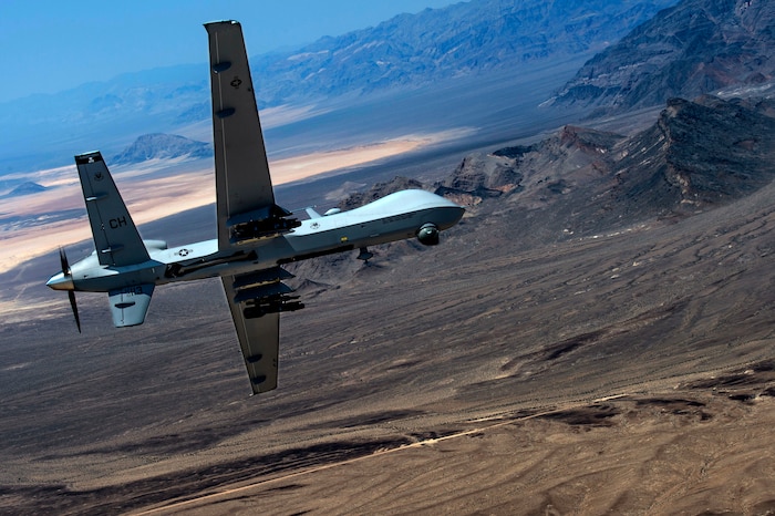 An MQ- Reaper remotely piloted aircraft performs aerial maneuvers over Creech Air Force Base, Nev., June 25, 2015. The MQ-9 Reaper is an armed, multi-mission, medium-altitude, long-endurance remotely piloted aircraft that is employed primarily as an intelligence-collection asset and secondarily against dynamic execution targets. (U.S. Air Force photo by Senior Airman Cory D. Payne)