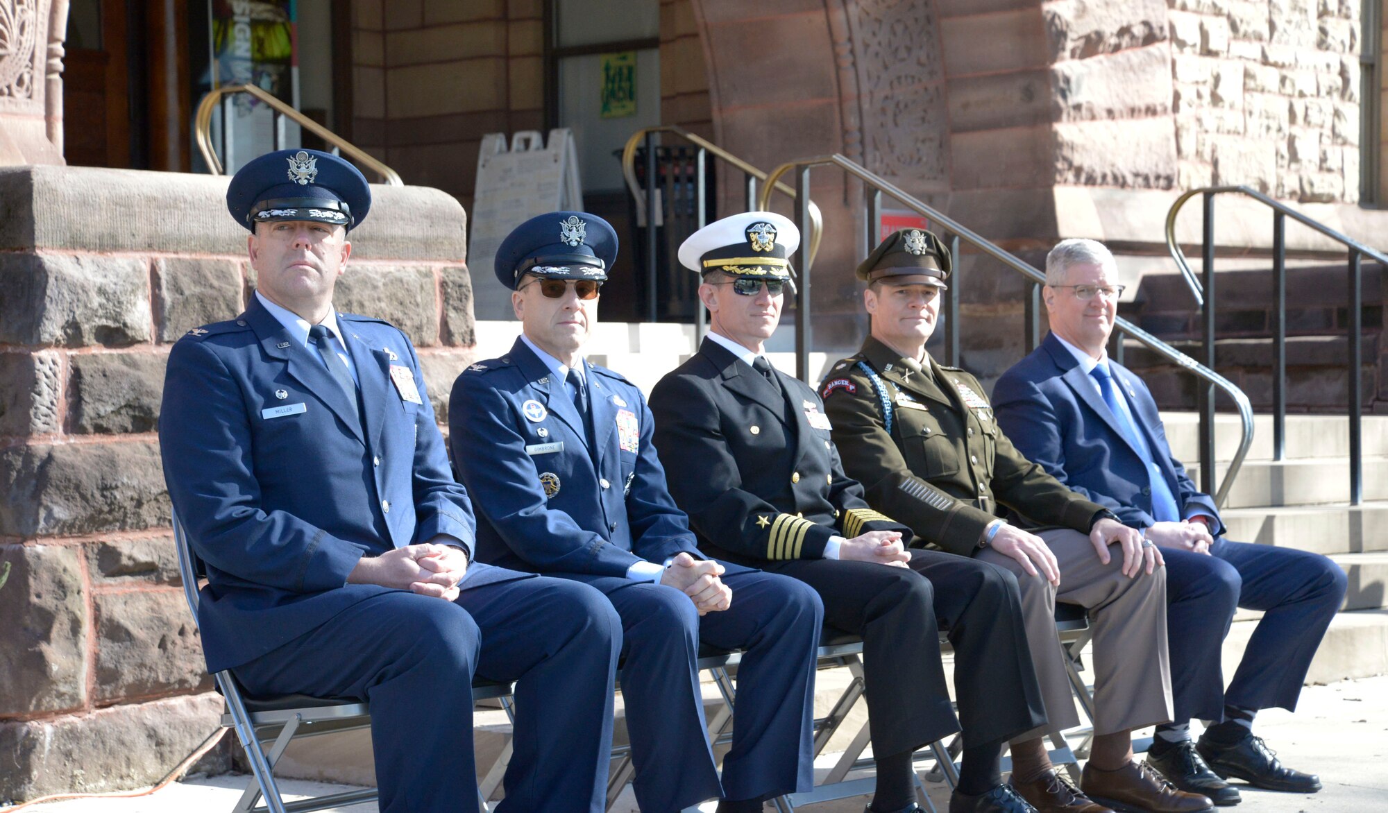 Col. Patrick Miller, 88th Air Base Wing and Wright-Patterson Air Force Base commander, Detachment 645 commanders and Maj Gen. (retired) Mark Bartman look upon Air Force, Army and Navy ROTC cadets commencing the Tri-Service Parade April 14, 2022 at Ohio State University. The Tri-Service Parade has been a tradition at Ohio State University since 1916, and allows several cadets and midshipmen to receive scholarship awards from generous donors. (U.S. Air Force photo by Darrius Parker)