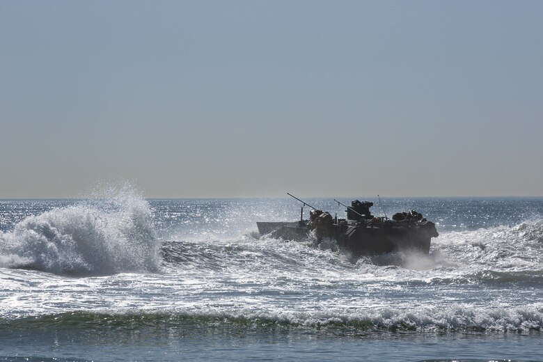 U.S. Marine Corps Amphibious Combat Vehicles conduct a shore-to-ship and ship-to-shore training exercise with embarked troops, demonstrating capability and competency during waterborne operations. (U.S. Marine Corps photo by Cpl. Quince Bisard)