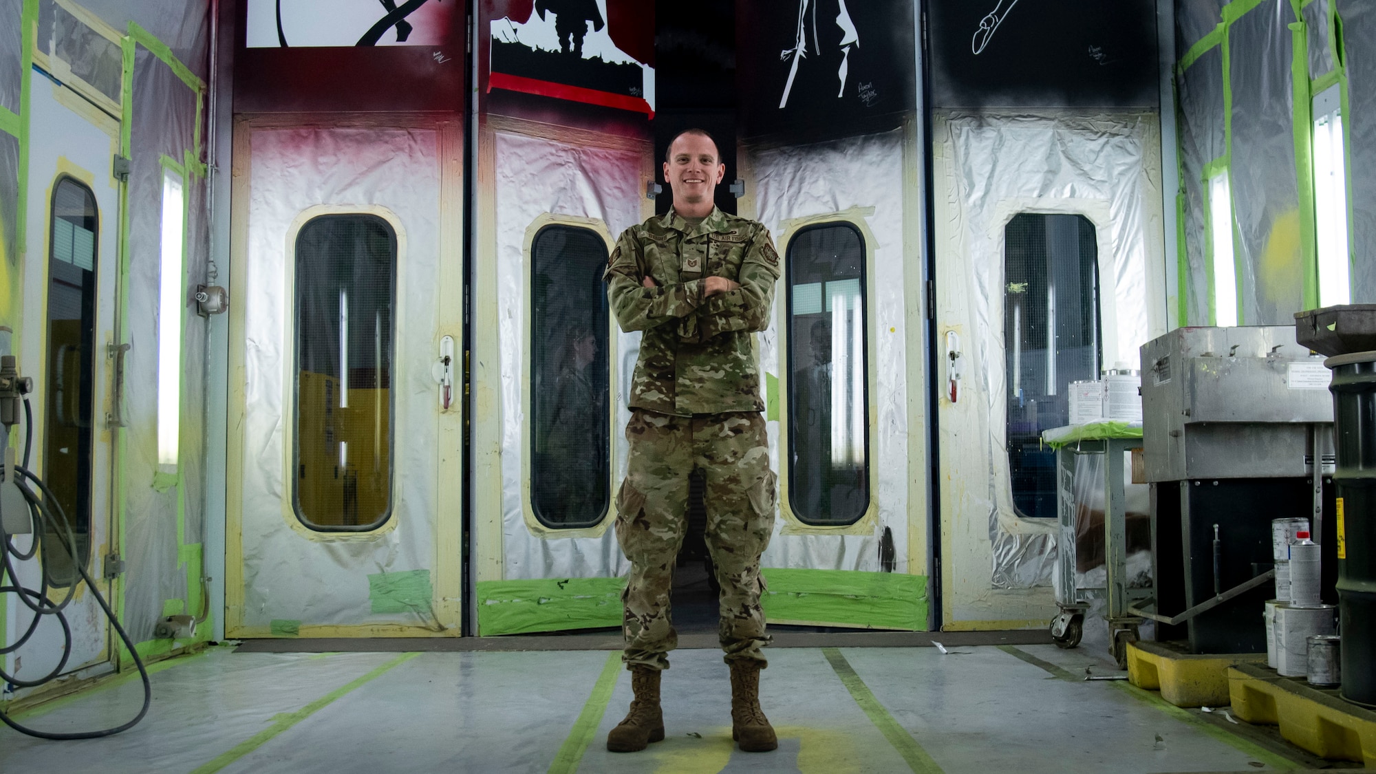 U.S. Air Force Tech. Sgt. Kurtis Geiger, noncommissioned officer in charge of the 6th Maintenance Squadron corrosion control unit, poses in a spray-booth at MacDill Air Force Base, Florida, April 12, 2022.