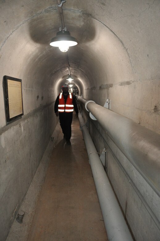 Mike Villaneuva, operations and maintenance supervisor, U.S. Army Corps of Engineers Los Angeles District, traverses the passage way running the entire length of the massive concrete Sepulveda Dam, March 22 in Van Nuys, California.