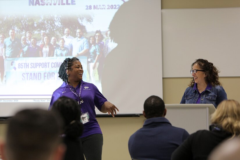 Ariesa Evans, left, assigned to the 85th U.S. Army Reserve Support Command’s 3rd Regiment, 338th Battalion, and Carmella Navarro, Suicide Prevention Program Manager, 85th USARSC, laugh at a comment during introductions at the Command’s Stand for Life suicide prevention training event in Nashville, Tennessee, March 28 – 30, 2022.