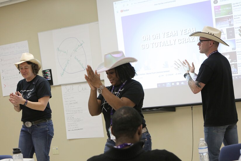 Class trainers build class energy through karaoke, while on a 10-minute break, during the 85th U.S. Army Reserve Support Command’s Stand for Life suicide prevention training event in Nashville, Tennessee, March 28 – 30, 2022.