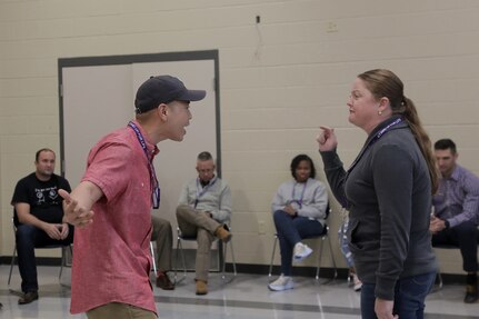 Capt. Jerry Duong, left, 189th Infantry Brigade, and Sgt. 1st Class Emily Brandt, 3rd Regiment, 361st Battalion, conduct a skit as part of their teach backs on learned training during the 85th U.S. Army Reserve Support Command’s Stand for Life suicide prevention training event in Nashville, Tennessee, March 28 – 30, 2022.