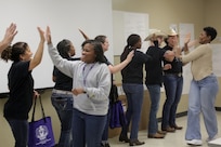 Suicide prevention liaisons high five trainers before receiving training certificates following the 85th U.S. Army Reserve Support Command’s Stand for Life suicide prevention training event in Nashville, Tennessee, March 28 – 30, 2022.