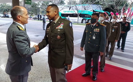 Lt. Gen. Alcides Valeriano de Faria Junior, deputy chief of staff for international affairs, Brazilian Army, left, greets Maj. Gen. William L. Thigpen, U.S. Army South commanding general during his arrival to the opening ceremony of the Conference of American Armies in Brazilia, Brazil, Apr. 18, 2022.