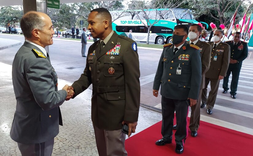 Lt. Gen. Alcides Valeriano de Faria Junior, deputy chief of staff for international affairs, Brazilian Army, left, greets Maj. Gen. William L. Thigpen, U.S. Army South commanding general during his arrival to the opening ceremony of the Conference of American Armies in Brazilia, Brazil, Apr. 18, 2022.